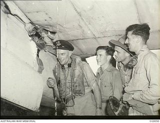 MILNE BAY, PAPUA. 1943-07-22. BEAUFORT CREW OF NO. 100 SQUADRON RAAF WHICH TOOK PART IN A RAID ON JAPANESE INSTALLATIONS AT GASMATA AND RETURNED WITH SEVERED ELEVATOR CABLES ON HIS AIRCRAFT AS A ..