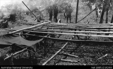 Structure with men in background