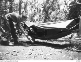 KILIGIA, NEW GUINEA. 1944-03-20. MR. PAUL BECKER, AUSTRALIAN PUBLIC RELATIONS FIELD UNIT AND VX72048 SERGEANT F. MCKECHNIE, AUSTRALIAN MILITARY HISTORY SECTION, LAND HEADQUARTERS