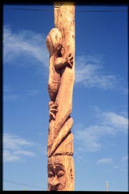 Carved pole with gecko