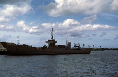 A port bow view of the US Army transport ship LT. COL. JOHN U.O. PAGE moored on the west side of Ford Island