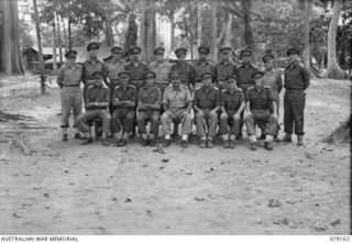 TOROKINA, BOUGAINVILLE ISLAND. 1945-02-21. NX49 BRIGADIER J.R. STEVENSON, DSO, COMMANDING, 11TH INFANTRY BRIGADE (15); WITH OFFICERS OF HIS HEADQUARTERS STAFF. IDENTIFIED PERSONNEL ARE:- QX49416 ..