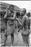 Women preparing shell money strings