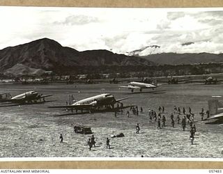 NADZAB, NEW GUINEA. 1943-09-20. TRANSPORT AIRCRAFT USED TO SUPPLY THE 7TH AUSTRALIAN DIVISION, LINED UP ON NO. 1 AIRSTRIP