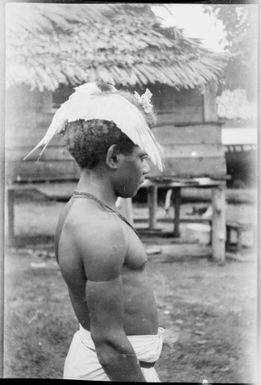 Boy with a bird on his head, New Guinea, ca. 1929 / Sarah Chinnery