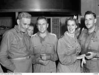 RABAUL, NEW BRITAIN. 1945-12-28. THE PRIME MINISTER OF AUSTRALIA, MR BEN CHIFLEY, ARRIVED BY PLANE TO VISIT MANY OF THE UNITS IN THE AREA. MR CHIFLEY TALKING TO SOME OF THE GUESTS AT THE OPENING OF ..