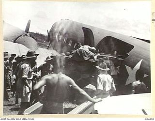 1943-04-08. NEW GUINEA. AERIAL TRANSPORT HAS PLAYED A TREMENDOUS PART IN THE NEW GUINEA CAMPAIGN, AND AT WAU CAUSED THE SPEEDY DEFEAT OF THE ADVANCING JAPANESE. HERE A JEEP IS BEING BACKED OUT OF A ..