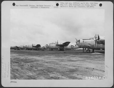 Consolidated B-24 Liberators Of The 7Th Bomber Command On Line At Isley Airfield, Saipan, Marianas, 8 August 1944. The B-24 'Liberty Belle' Is In The Foreground. (U.S. Air Force Number 63603AC)