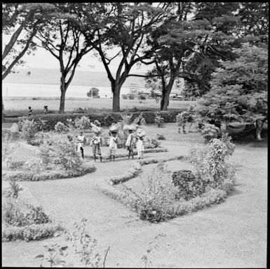 Five laden women in Chinnery's garden, Malaguna Road, Rabaul, New Guinea, ca. 1936, 1 / Sarah Chinnery