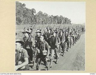 LAE, NEW GUINEA. 1944-10-07. A MARCH PAST OF THE 2/8TH COMMANDO SQUADRON. IDENTIFIED PERSONNEL ARE:- TROOPER J.E. DONOVAN (1); TROOPER A.S. FORD (2); TROOPER N. MATTSSON (3); TROOPER J. PORTER (4); ..