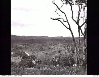 SOGERI, NEW GUINEA. 1943-11-04. VIEW FROM THE BACK OF THE NEW GUINEA FORCE TRAINING SCHOOL, SHOWING PORTION OF THE ROAD WHICH LEADS FROM ROUNA TO PORT MORESBY