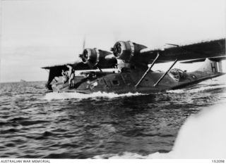 AN RAAF PBY CATALINA, A24-17, ON THE SURFACE IN NEW GUINEA WATERS DURING WW2