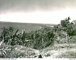 THE SOLOMON ISLANDS, 1945-10-14. A COASTAL VIEW OF PART OF BOUGAINVILLE ISLAND. (RNZAF OFFICIAL PHOTOGRAPH.)