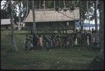 Group of women and children in a village