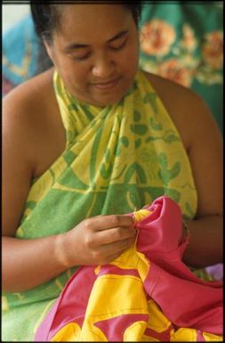 Woman sewing tivaevae