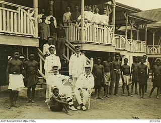 COLONEL WILLIAM HOLMES AND STAFF AT GOVERNMENT HOUSE, NAMANULA, RABAUL, 1914. STANDING, LEFT TO RIGHT: LIEUTENANT F.G. CRESSWELL RAN, CAPTAIN R.J.A. TRAVERS. SITTING: COLONEL HOLMES AND MAJOR F.B. ..