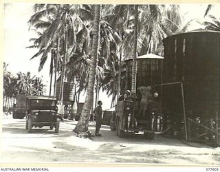 TWO OF THE 15,000 GALLON STORAGE TANKS USED BY NO. 2 PLATOON, 23RD FIELD COMPANY, TO STORE THE FRESH WATER WHICH THEY DISTIL FROM THE SALT WATER DRAWN FROM THE BEACH