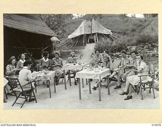 1943-06-10. NEW GUINEA. AT AN AUSTRALIAN GENERAL HOSPITAL IN NEW GUINEA. AMERICAN NURSES HAVE AFTERNOON TEA WITH AUSTRALIAN NURSES. (NEGATIVE BY N. BROWN)