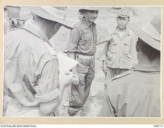 MISSION POINT, NEW GUINEA. 1945-11-09. A SUSPECTED JAPANESE WAR CRIMINAL BEING IDENTIFIED FOR ATROCITIES COMMITTED AGAINST INDIAN PRISONERS OF WAR. THE IDENTIFICATION PARADE WAS ARRANGED BY THE WAR ..