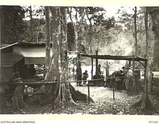 SCARLET BEACH, NEW GUINEA, 1944-03-19. ARMY COOKS RECEIVING TRAINING IN FIELD COOKING AND CATERING AT THE 22ND INFANTRY BATTALION, 5TH DIVISION AND SUPERVISED BY WARRANT OFFICER II, R. STEWART, ..