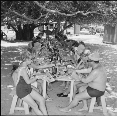 Tourists having lunch under the trees, Isle of Pines, New Caledonia, 1967 / Michael Terry