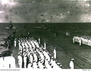 NEW BRITAIN, 1945-09-06. BRITISH SAILORS ON PARADE ON THE FLIGHT DECK OF HMS GLORY OFF RABAUL DURING THE JAPANESE SURRENDER CEREMONY. (RNZAF OFFICIAL PHOTOGRAPH.)
