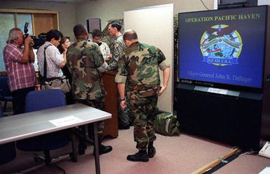 US Air Force Major General (MGEN) John R. Dallager, Commander Joint Task Force OPERATION PACIFIC HAVEN, answers media questions at Andersen AFB, Guam. Pacific Haven, a joint humanitarian effort conducted by the U.S. Military, airlifted over 2100 Kurdish refugees from northern Iraq. The Refugees will be housed temporarily at Andersen AFB, Guam, while they go through the immigration process for residence into the United States