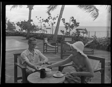 Dr Mrs Ferson and unidentified man enjoying a cup of tea, Tahiti