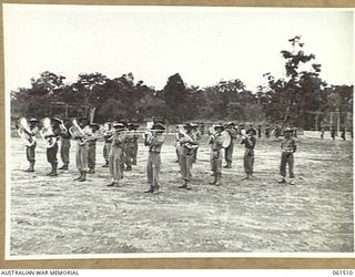 POM POM VALLEY, NEW GUINEA. 1943-11-30. BAND OF THE 18TH AUSTRALIAN INFANTRY BRIGADE, WHICH SUPPLIED THE MUSIC DURING THE COMMANDING OFFICER'S PARADE OF THE 2/12TH AUSTRALIAN INFANTRY BATTALION. ..