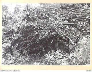 TOROKINA AREA, BOUGAINVILLE. 1945-07-28. AN M24 GENERAL CHAFFEE LIGHT TANK UNDERGOING TESTS FOR THE WAR OFFICE. IT IS VIEWED FROM OFF SIDE FRONT WITH ITS GUN TRAVERSED TO FRONT