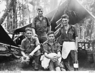 PROTHERO 2 AREA, FARIA RIVER, NEW GUINEA, 1944-02-16. COOKS OF HEADQUARTERS COMPANY, 57/60TH INFANTRY BATTALION. IDENTIFIED PERSONNEL ARE: V122095 PRIVATE A.T. BONNEY (1); QX55356 PRIVATE A. ..