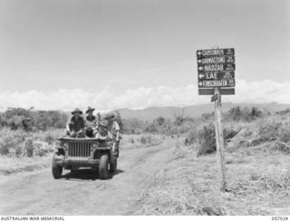 NADZAB AIRSTRIP, NEW GUINEA. 1943-09-19. SIGNPOST ON THE ROAD BETWEEN NO. 1 AND NO. 2 AIRSTRIPS