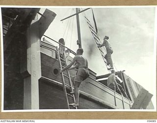 BALASANA, NEW GUINEA, 1943-07-06. NEW VESSEL NEARING COMPLETION ON THE SLIPWAYS OF THE 1ST AUSTRALIAN WATER TRANSPORT GROUP MAINTENANCE BASE