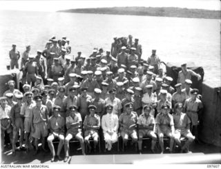 OCEAN ISLAND. 1945-10-01. GROUP PORTRAIT OF THE SHIP'S COMPANY, HMAS DIAMANTINA, AFTER THE SURRENDER CEREMONY HELD ABOARD HMAS DIAMANTINA WHEN LIEUTENANT COMMANDER NAOOMI SUZUKI, COMMANDER JAPANESE ..