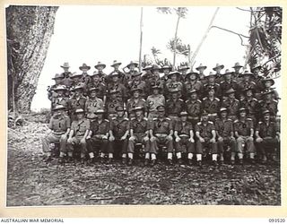 TOKO, BOUGAINVILLE. 1945-06-30. MAJOR GENERAL W. BRIDGEFORD, GENERAL OFFICER COMMANDING 3 DIVISION (6), WITH STAFF OFFICERS AT DIVISIONAL HEADQUARTERS, HEADQUARTERS 3 DIVISION