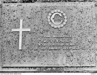 A COMMEMORATIVE PLAQUE AT AMBON WAR CEMETERY. THIS PLAQUE MARKS THE FINAL RESTING SPOT FOR THE FAMOUS WARTIME PHOTOGRAPHER DAMIEN PARER. KILLED AT PELELIU IN 1944 HIS REMAINS WERE TRANSFERRED IN ..