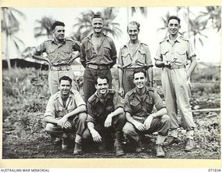 LAE, NEW GUINEA. 1944-03-29. GROUP PORTRAIT OF THE ADMINISTRATIVE STAFF AT THE 43RD FIELD ORDNANCE DEPOT. LEFT TO RIGHT, BACK ROW: NX65955 PRIVATE (PTE) A. E. MCAULAY; SX12798 SX12798 PTE C. D. ..