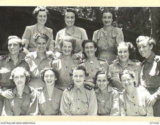 HELDSBACH MISSION, FINSCHHAFEN AREA, NEW GUINEA. 1944-03-13. SISTERS OF THE 2/3RD AND 106TH CASUALTY CLEARING STATION, AUSTRALIAN ARMY NURSING SERVICE OUTSIDE THEIR MESS. VFX8396 SISTER J. LANGHAM, ..