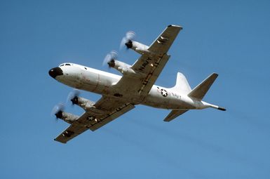 A left front view of a P-3 Orion patrol aircraft taking off