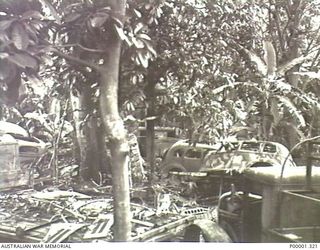NEW BRITAIN, 1945-09. A DUMP OF DAMAGED JAPANESE USED MOTOR VEHICLES NEAR RABAUL. (RNZAF OFFICIAL PHOTOGRAPH.)