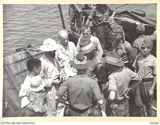 SORAKEN PENINSULA, BOUGAINVILLE. 1945-09-14. A MOTOR LAUNCH CARRYING MEMBERS OF HEADQUARTERS 2 CORPS, PREPARED FOR SURRENDER DISCUSSIONS WITH THE JAPANESE AT A SEA RENDEZVOUS OFF SORAKEN PENINSULA, ..