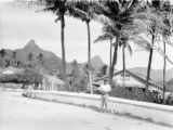 Avarua (Cook Islands), people on street in town with mountains in distance