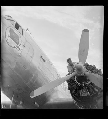 Qantas Empire Airways, DC 3 aircraft being serviced, Lae airfield, Papua New Guinea