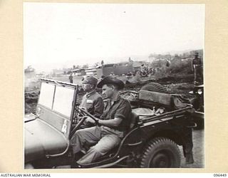 CAPE WOM, NEW GUINEA, 1945-09-13. LIEUTENANT-GENERAL H. ADACHI, COMMANDER 18 JAPANESE ARMY IN NEW GUINEA ARRIVING IN AN AUSTRALIAN JEEP (DRIVER BISHOP) FOR THE SURRENDER CEREMONY HELD AT CAPE WOM ..