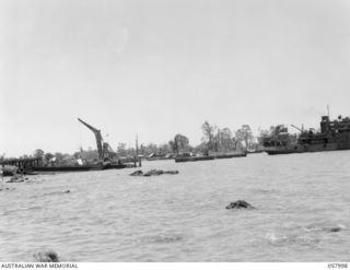 LAE, NEW GUINEA. 1943-10-12. VIEW OF THE DOCKS FROM THE AERODROME END OF THE BEACH