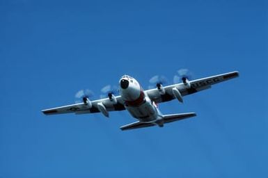 A front view of a Coast Guard C-130 Hercules aircraft taking off