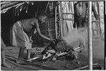 Food preparation: heating oven stones in a fire