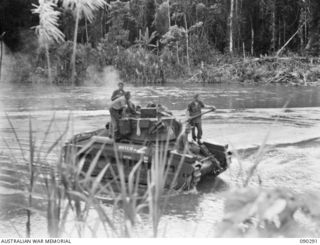 BOUGAINVILLE. 1945-03-30. A MATILDA TANK OF B SQUADRON, 2/4 ARMOURED REGIMENT COMING OUT OF THE WATER AFTER CROSSING THE PURIATA RIVER DURING THE MOVE FORWARD TO SUPPORT 25 INFANTRY BATTALION