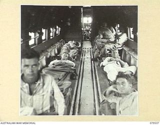 DREGER HARBOUR, NEW GUINEA. 1943-08. STRETCHER PATIENTS SECURELY ANCHORED IN THE INTERIOR OF THE DOUGLAS C47 DAKOTA TRANSPORT AIRCRAFT BEFORE TAKING OFF FOR THE MAINLAND