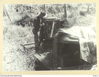 HANSA BAY, NEW GUINEA. 1944-06-16. A MOBILE SEARCHLIGHT ABANDONED IN THE JUNGLE BY RETREATING ENEMY FORCES